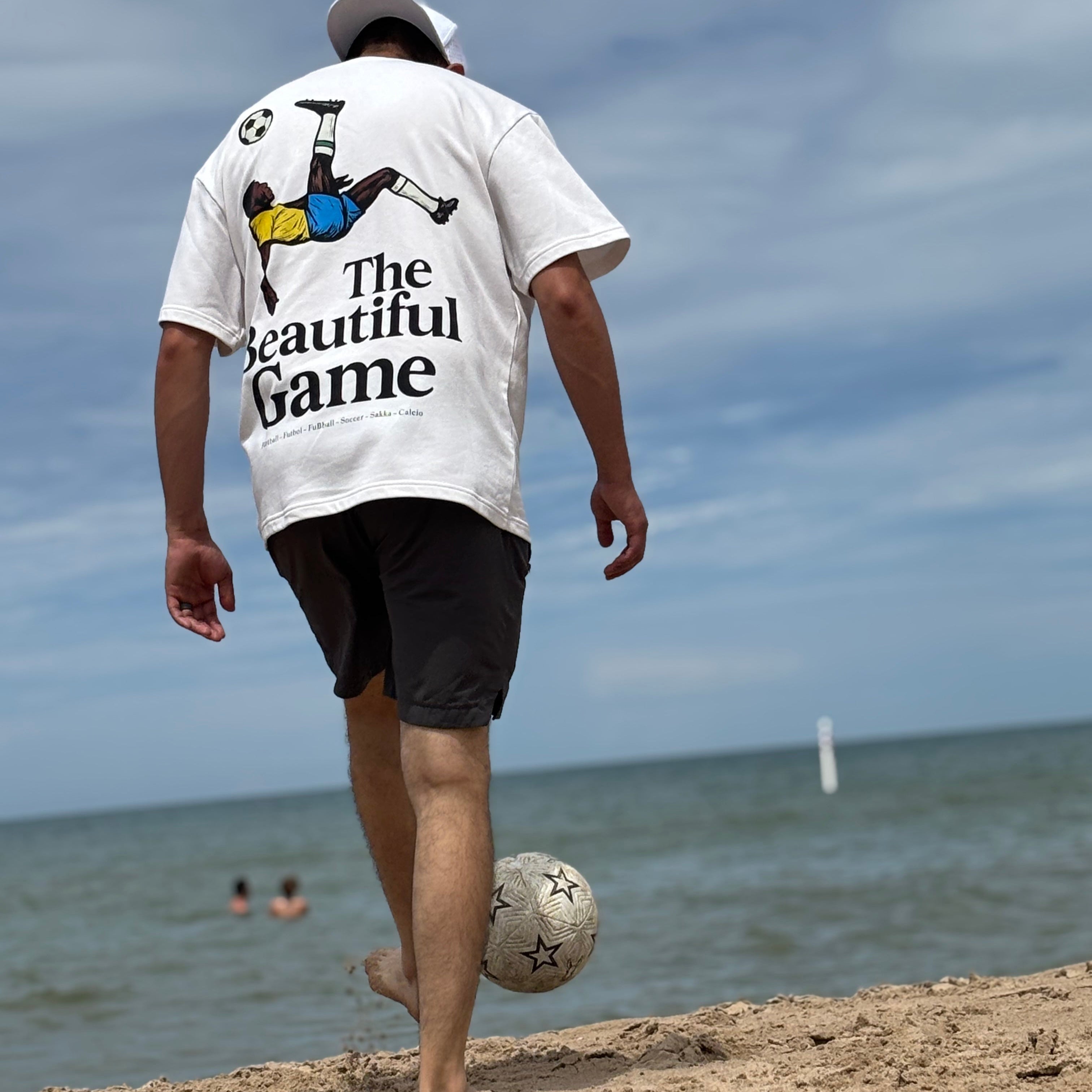 The Beautiful Game graphic tee, for soccer and football enthusiasts. Street wear to show your love of the world's sport. 